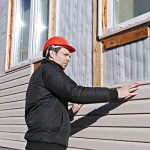 Man Installing Exterior Siding